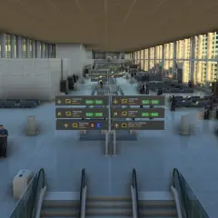 Nowoczesny terminal lotniska Malaga z rzędami siedzeń, tablicami informacyjnymi i pasażerami czekającymi na loty.