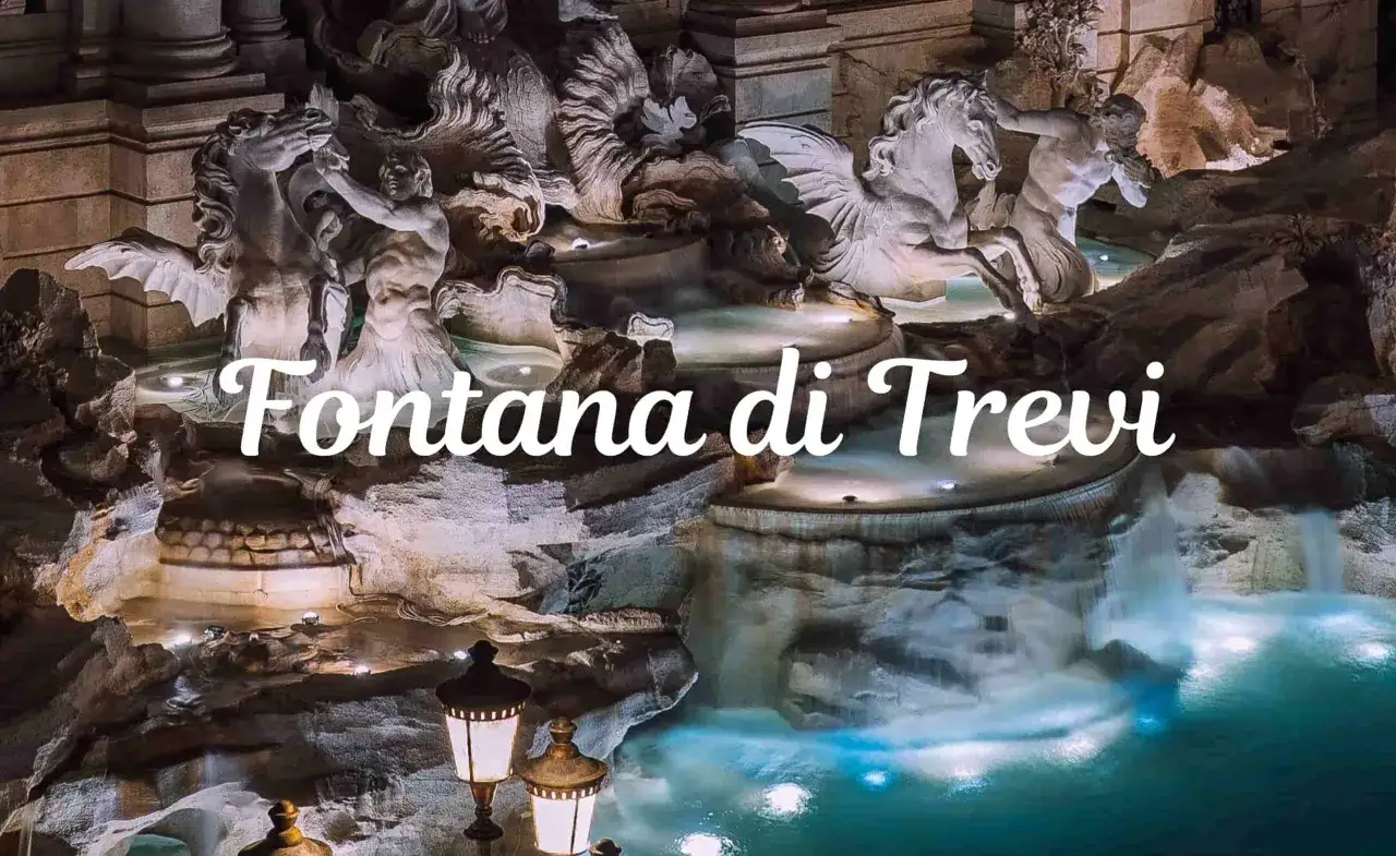 Nocna iluminacja Fontanny di Trevi w Rzymie, z rzeźbami koni morskich i wodospadami.